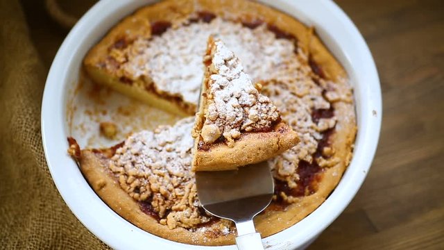 sweet cake with jam in ceramic form