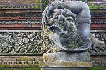 Fototapeta na wymiar Traditional stone statues depicting demons, gods and Balinese mythological deities in Bali,Indonesia
