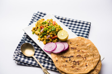 Paneer Bhurji, mildly spiced cottage cheese scramble and served with roti or laccha paratha, selective focus