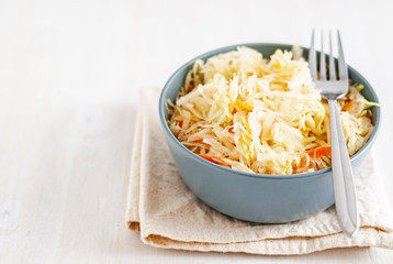 Bowl with sauerkraut and fork
