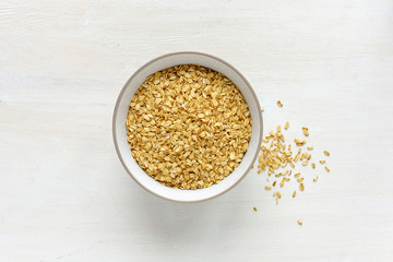 Bowl of dry oatmeal viewed from above