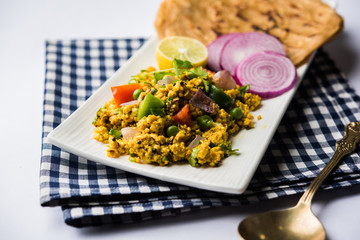 Paneer Bhurji, mildly spiced cottage cheese scramble and served with roti or laccha paratha, selective focus