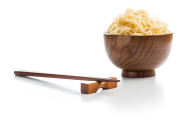 Wooden chopsticks and instant noodles.