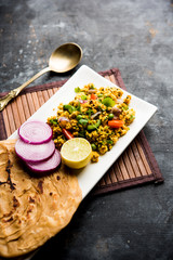 Paneer Bhurji, mildly spiced cottage cheese scramble and served with roti or laccha paratha, selective focus