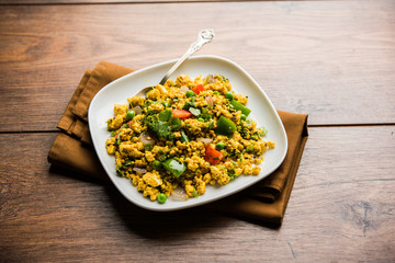 Paneer Bhurji, mildly spiced cottage cheese scramble and served with roti or laccha paratha, selective focus
