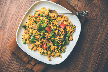 Paneer Bhurji, mildly spiced cottage cheese scramble and served with roti or laccha paratha, selective focus