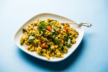 Paneer Bhurji, mildly spiced cottage cheese scramble and served with roti or laccha paratha, selective focus