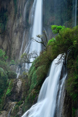 Fototapeta premium Great waterfall in Thailand. Beautiful waterfall in the green forest. Waterfall in tropical forest at Umpang National park, Tak, Thailand.