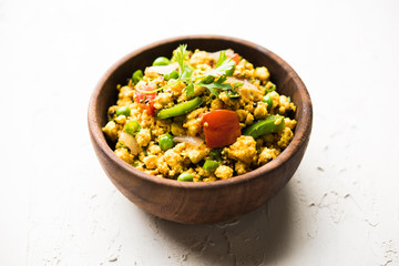 Paneer Bhurji, mildly spiced cottage cheese scramble and served with roti or laccha paratha, selective focus