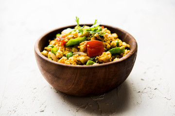 Paneer Bhurji, mildly spiced cottage cheese scramble and served with roti or laccha paratha, selective focus