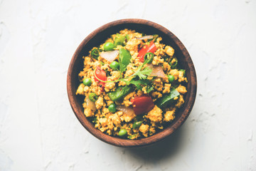 Paneer Bhurji, mildly spiced cottage cheese scramble and served with roti or laccha paratha, selective focus