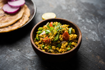 Paneer Bhurji, mildly spiced cottage cheese scramble and served with roti or laccha paratha, selective focus