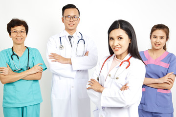 Fototapeta premium Medical workers on wall background