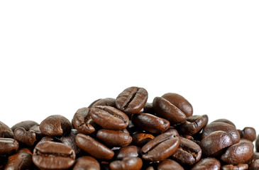roasted coffee beans heap or pile isolated on white background