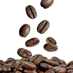 Coffee beans falling isolated on white background