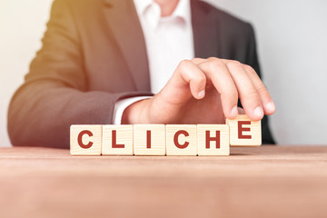 Man made word CLICHÉ with wood blocks