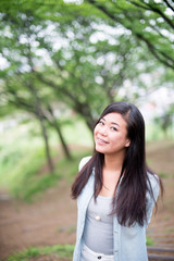 Asian female model poses for pictures on the street
