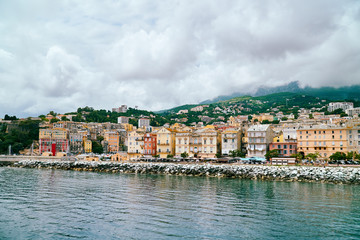 Obraz premium View of Bastia city in Corsica from the port on cloudy day, Corse