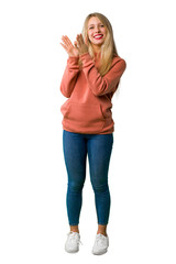 A full-length shot of a Young girl applauding after presentation in a conference on isolated white background