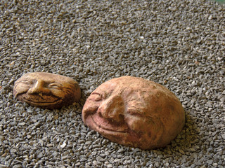 Clay pottery on black stones