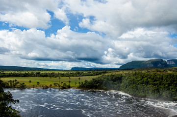 Fototapeta na wymiar scenic landscape of wild and pristine venezuela canaima park with majestic waterfalls and dramatic cloudy sky and tepuy