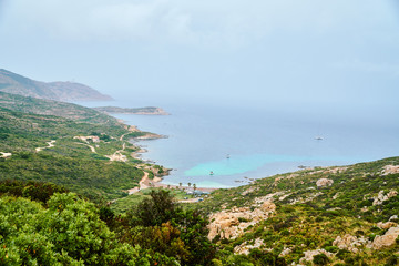 Fototapeta na wymiar View of a bay on Corsica, Corse during the rain storm