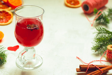 Mulled wine with spices and gifts on the table. Happy New Year! Top view