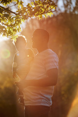 Father carrying his son outdoors