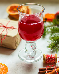 Mulled wine with spices and gifts on the table. Happy New Year! Top view