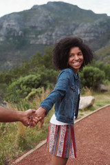 Attractive african american woman smiling back at boyfriend