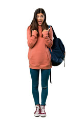 A full-length shot of a Teenager girl with sweatshirt and backpack with surprise facial expression