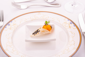 A horn from the baked test with pumpkin cream and sesame