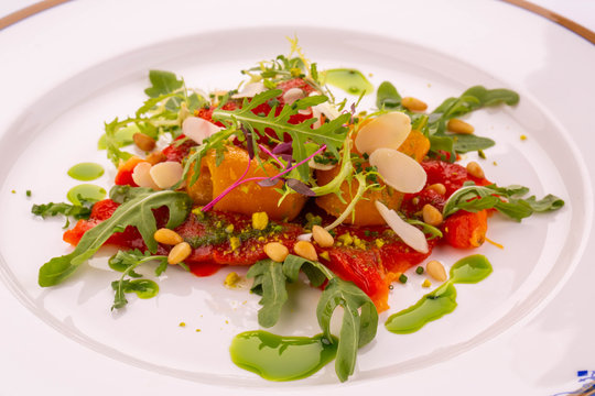 Karpacho from baked pepper with Pesto, pass cress and a nut mix