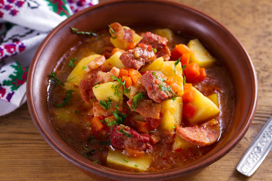 Goulash soup bograch in a bowl. Hungarian dish. Stew, made with beef, bacon, sausages, potatoes and carrots
