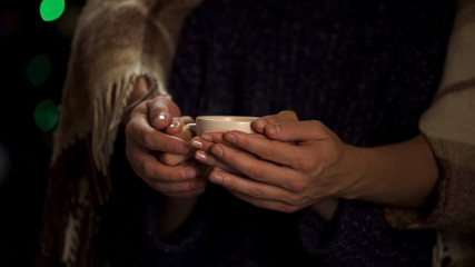 Social worker tenderly covering female at lonely people asylum, winter holidays