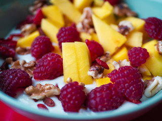 Delicious fruit bowl with red background