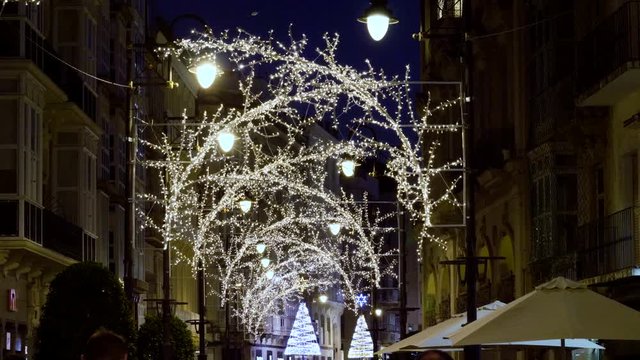 The city is decorated for Christmas with lights, ornaments and street decorations. 4K