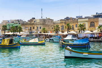 Fototapeta premium VALLETTA, MALTA - June 28, 2017: Mediterranean traditional colorful boats in Malta