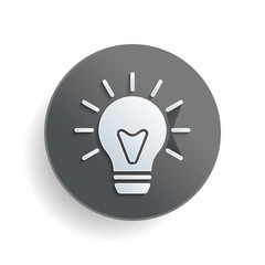 Fototapeta premium old bulb with light. simple single icon. White paper symbol on gray round button or badge with shadow