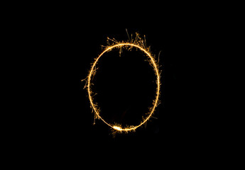 Numbers 0 or zero Sparkler firework light isolated on black background