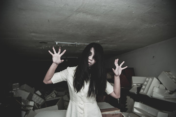 Portrait of asian woman make up ghost face with blood,Horror scene,Scary background,Halloween...