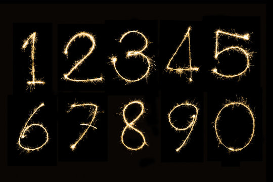 Numbers 0 - 9 Sparkler firework light isolated on black background
