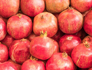 Fototapeta na wymiar vibrant red pomegranate fruits top view
