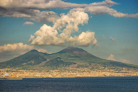 Naples, seen on posillipo and on the,  semi covered by white clouds, vulcano vesuvius