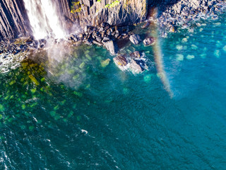 Aerial view of the dramatic coastline at the cliffs by Staffin with the famous Kilt Rock waterfall - Isle of Skye - Scotland