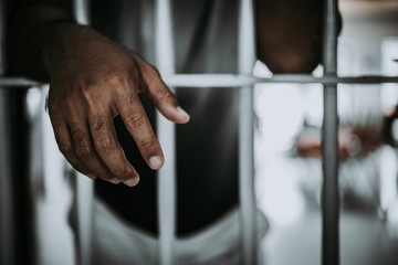 Hands of men desperate to catch the iron prison,prisoner concept,thailand people,Hope to be free.