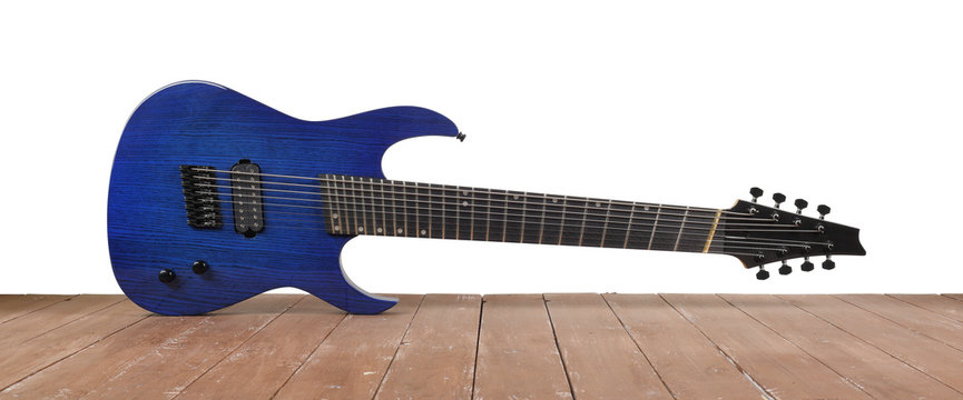 Musical instrument - Blue 8-srtings guitar wood and white background