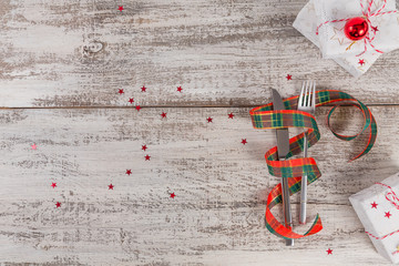 Winter table place setting with Christmas or New Year decorations.