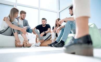group of young people discussing the start of their business