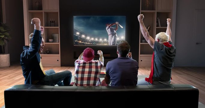 Group Of Fans Are Watching A Baseball Moment On The TV And Celebrating A Victory, Sitting On The Couch In The Living Room. The Living Room Is Made In 3D.